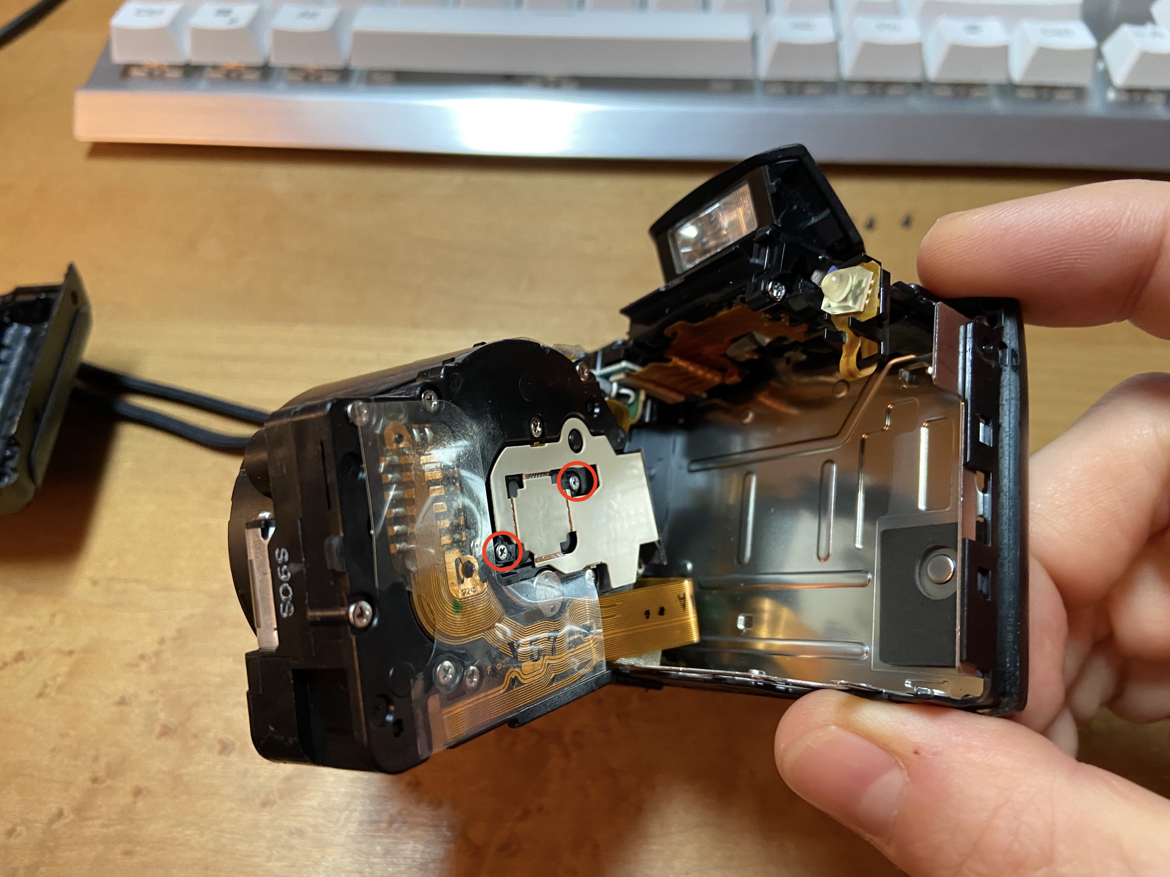 Accessing lens and sensor assembly screws